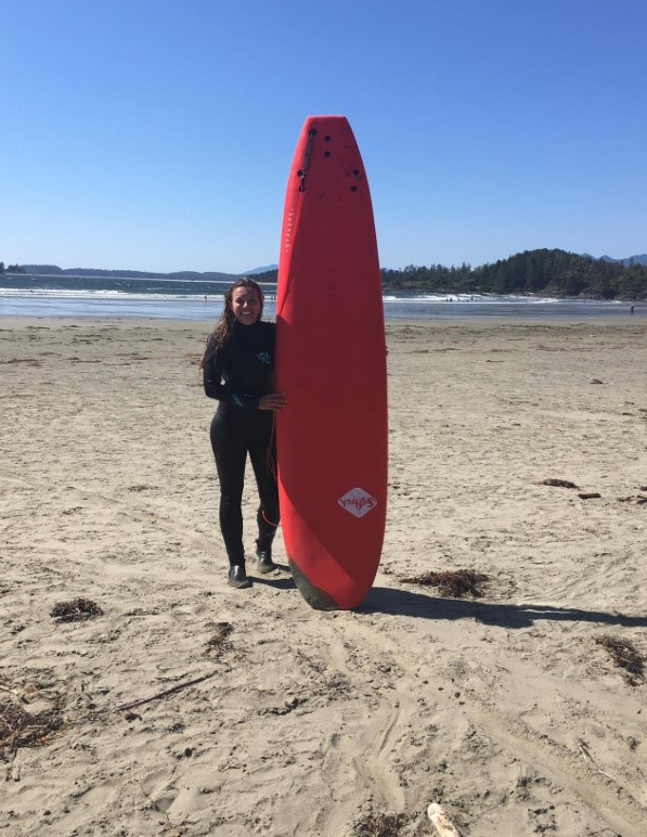 Roxana with surfboard